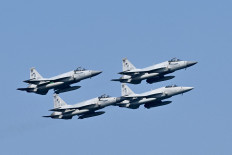 Pakistan's Air Force fighter JF-17 fighter jets fly past during the multinational naval exercise AMAN-25 in the Arabian Sea near Pakistan's port city of Karachi on February 10, 2025, as more than 50 countries participating with ships and observers. 