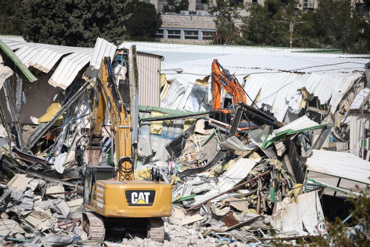 A photograph shows heavy machinery demolishing a structure inside the headquarters of the United Nations Relief and Works Agency (UNRWA) in the Sheikh Jarrah neighborhood of Israeli-annexed East Jerusalem on Jan. 20, 2026.
