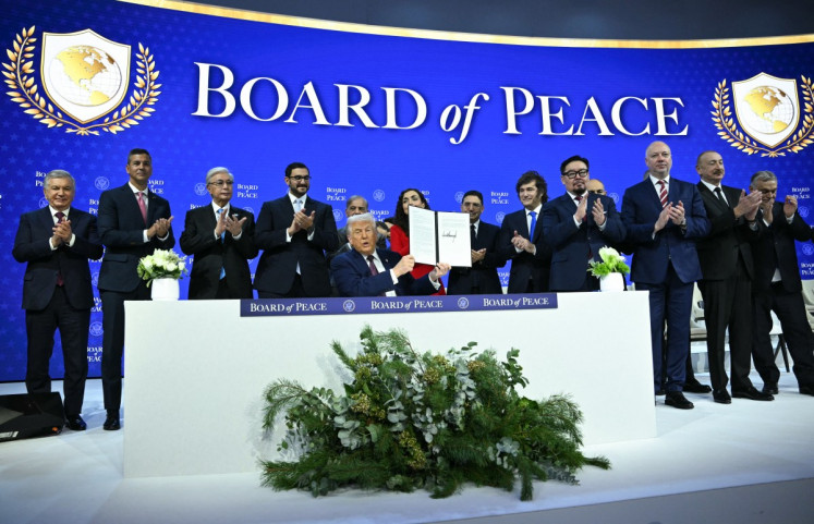 Paraguay's President Santiago Pena, Pakistan's Prime Minister Shehbaz Sharif, Kosovo's President Vjosa Osmani, Argentina's President Javier Milei, Armenia's Prime Minister Nikol Pashinyan, Bulgaria's former Prime Minister Rosen Zhelyazkov, Azerbaijan's President Ilham Aliyev and Hungary's Prime Minister Viktor Orban applaud as US President Donald Trump holds a signing founding charter at the &ldquo;Board of Peace&ldquo; meeting during the World Economic Forum (WEF) annual meeting in Davos on January 22, 2026. US President Donald Trump will show off his new &ldquo;Board of Peace&ldquo; at Davos on January 22, 2026 burnishing his claim to be a peacemaker a day after backing off his own threats against Greenland. 