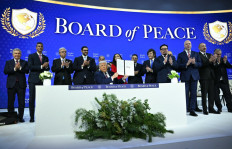 Paraguay's President Santiago Pena, Pakistan's Prime Minister Shehbaz Sharif, Kosovo's President Vjosa Osmani, Argentina's President Javier Milei, Armenia's Prime Minister Nikol Pashinyan, Bulgaria's former Prime Minister Rosen Zhelyazkov, Azerbaijan's President Ilham Aliyev and Hungary's Prime Minister Viktor Orban applaud as US President Donald Trump holds a signing founding charter at the &ldquo;Board of Peace&ldquo; meeting during the World Economic Forum (WEF) annual meeting in Davos on January 22, 2026. US President Donald Trump will show off his new &ldquo;Board of Peace&ldquo; at Davos on January 22, 2026 burnishing his claim to be a peacemaker a day after backing off his own threats against Greenland. 