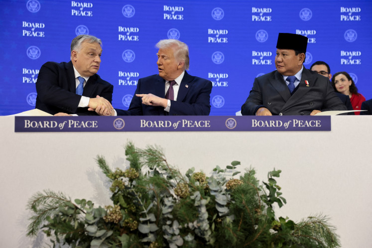 United States President Donald Trump shakes hands with Hungary's Prime Minister Viktor Orban on Jan. 22, 2026, next to's President Prabowo Subianto, as they take part in a charter announcement for Trump's Board of Peace initiative aimed at resolving global conflicts, alongside the 56th annual World Economic Forum (WEF), in Davos, Switzerland. 