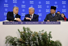 United States President Donald Trump shakes hands with Hungary's Prime Minister Viktor Orban on Jan. 22, 2026, next to's President Prabowo Subianto, as they take part in a charter announcement for Trump's Board of Peace initiative aimed at resolving global conflicts, alongside the 56th annual World Economic Forum (WEF), in Davos, Switzerland. 