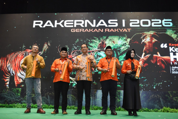 Chairman of the Gerakan Rakyat (People's Movement) Party Sahrin Hamid (second left), honorary member Anies Baswedan (center), head of the advisory council Sulfikar Amir (left), secretary-general M. Ridwan (second right) and treasurer Prita Subono (right) symbolically open the party's first national working meeting for 2026 in Jakarta on Jan. 17, 2026. 