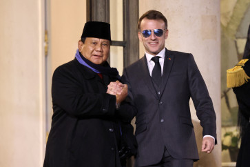 France's President Emmanuel Macron welcomes Indonesia's president Prabowo Subianto prior to their meeting at the Elysee palace in Paris, on January 23, 2026. 