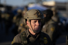 US Border Patrol Chief Greg Bovino leads his troop as they confront demonstrators outside of an immigrant processing center on September 27, 2025 in Broadview, Illinois. 