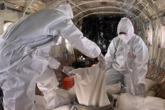 Make it rain: Personnel prepare materials for cloud seeding on Jan. 24, 2026 during a weather modification operation in Jakarta that aimed to prevent flooding caused by heavy rainfall during the monsoon season.