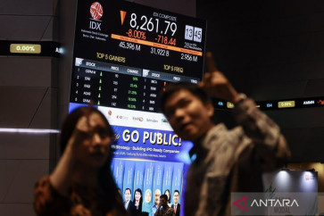 Employees stand near a screen showing the Composite index down 8 percent at the Indonesia Stock Exchange (IDX) in Jakarta on Jan. 28, 2026. The IDX temporarily halted trading that afternoon as the benchmark index dropped to 8,261.79 points following an announcement from Morgan Stanley Capital International's (MSCI) that it would temporarily suspend the index rebalancing process for Indonesian stocks.