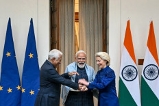 India's Prime Minister Narendra Modi (enter), European Commission President Ursula von der Leyen (right) and European Council President Antonio Costa gesture as they pose for a photograph before their meeting at the Hyderabad House in New Delhi on Jan. 27, 2026.