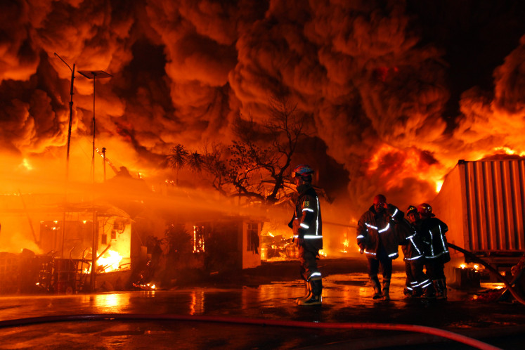 Firefighters battle flames on Jan. 28, 2026 at the Swallow sandal factory in Medan, North Sumatra. The fire broke out on Jan. 27 at around 9:30 p.m. and was only fully extinguished 31 hours later.