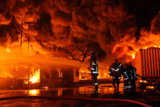 Firefighters battle flames on Jan. 28, 2026 at the Swallow sandal factory in Medan, North Sumatra. The fire broke out on Jan. 27 at around 9:30 p.m. and was only fully extinguished 31 hours later.