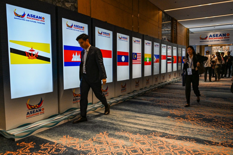 Screens display flags of ASEAN member countries at a hallway at the Nustar Hotel during the ASEAN Foreign Ministers' Retreat in Cebu City, the Philippines on Jan. 28, 2026.