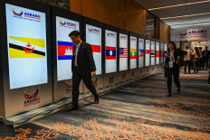 Screens display flags of ASEAN member countries at a hallway at the Nustar Hotel during the ASEAN Foreign Ministers' Retreat in Cebu City, the Philippines on Jan. 28, 2026.
