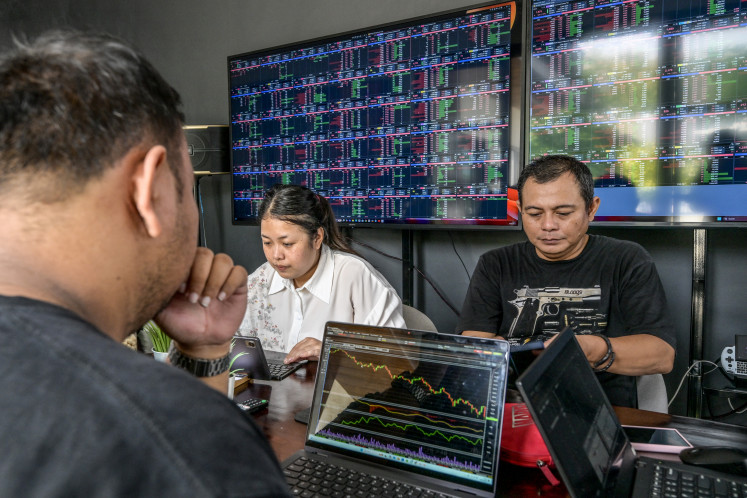 Stock traders monitor the Jakarta Composite Index (JCI) in South Tangerang, Banten, on April 8, 2025.