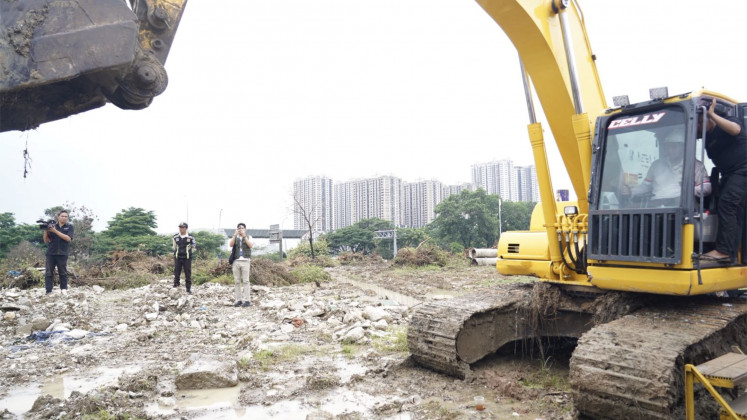 Breaking good: Public Housing and Settlement Areas Minister Maruarar "Ara" Sirait on Jan. 29, 2026, symbolically kicks off the land-clearing phase for the construction of subsidized apartment housing at the Meikarta site in Bekasi regency, West Java. 