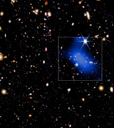 A developing galaxy cluster dating to about 1 billion years after the Big Bang is shown in this handout image released on Jan. 28, 2026. The white box marks the field of view of the Chandra X-ray Observatory data (blue) that is overlaid on an infrared image from the James Webb Space Telescope showing the location of galaxies.