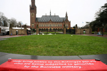 A banner in support of the Rohingya people is seen on Jan. 17, 2026, outside the International Court of Justice in The Hague, Netherlands, as the court began hearings in a landmark case brought by The Gambia, which accuses Myanmar of committing genocide against the Rohingya.