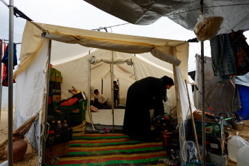 Huda Abu Abed&rsquo;s daughter stands inside a tent at a shelter after returning to Gaza through the Rafah crossing, in Khan Younis in the southern Gaza Strip, February 3, 2026.