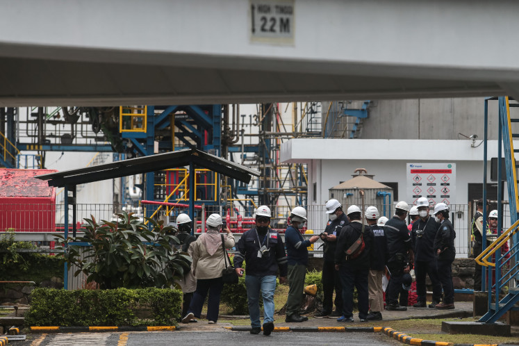 Environment Ministry enforcement officers inspect PT Vopak Terminal Merak in Cilegon, Banten, on Feb. 4, 2026, after a thick yellow-brown smoke release caused health concerns. 