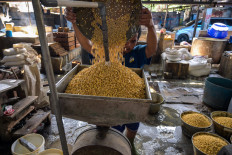 A worker rinses soybeans on Feb. 5, 2026, at a tofu factory in Surabaya, East Java. 