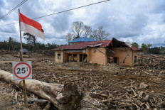 A partially collapsed house stands vacant on Jan. 29, 2026 in Garoga village of Batang Toru district, South Tapanuli regency, North Sumatra, over two months after flooding swept across three northern provinces on Sumatra in late November 2025.