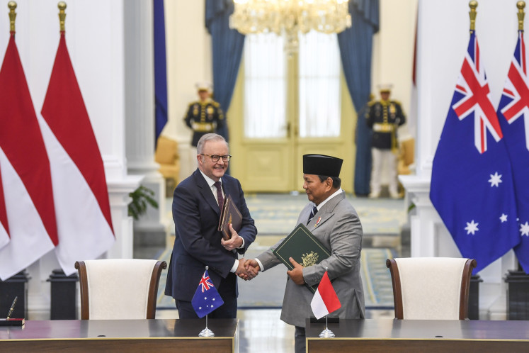 President Prabowo Subianto (right) shakes hands with Australian Prime Minister Anthony Albanese after signing the Treaty on Common Security during the latter's work visit to the State Palace in Jakarta on Feb. 6, 2026. The newly signed security agreement formalizes high-level consultations on common security interests between both countries.