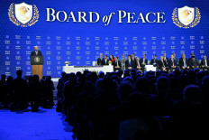 United States President Donald Trump (left) speaks at the Board of Peace launch during the World Economic Forum (WEF) annual meeting in Davos, Switzerland, on Jan. 22, 2026. 