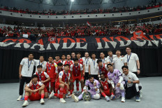 Indonesian senior men&rsquo;s futsal team players and officials pose with supporters after winning the runner-up title at the finals of the AFC Futsal Asian Cup 2026 at the Indonesia Arena in Jakarta on Feb. 7, 2026. Indonesia lost 5-4 in a penalty shootout against defending champion Iran in the final.