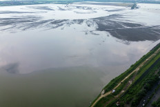 An aerial photo shows a containment pond at the center of the Lapindo mudflow eruption site in Porong, Sidoarjo, East Java, on Feb. 8, 2026. The Environment Ministry says it will soon prepare a Strategic Environmental Assessment as part of its efforts to manage the Lapindo mud disaster, which continues to spew hot mud from underground.