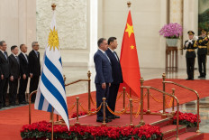 Uruguay's President Yamandu Orsi (left) stands with Chinese President Xi Jinping during a welcome ceremony at the Great Hall of the People in Beijing on Feb. 3, 2026.