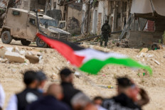 Palestinians protest after Israeli soldiers blocked the entrance of the Nur Shams Palestinian refugee camp in the occupied West Bank on February 9, 2026, demanding to be allowed to return to their homes from where they were expelled last year during an ongoing Israeli army operation. Saudi Arabia and seven other Muslim-majority countries on February 9 condemned new Israeli measures to tighten control of the West Bank and pave the way for more settlements in the occupied Palestinian territory. 