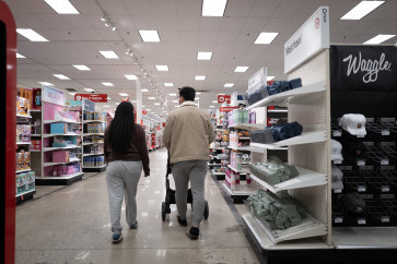 Customers shop at a Target store on Feb. 10, 2026 in Chicago, Illinois, US. Target plans to cut about 500 jobs at distribution centers and regional offices, but plans to increase the number of employees at their retail stores.