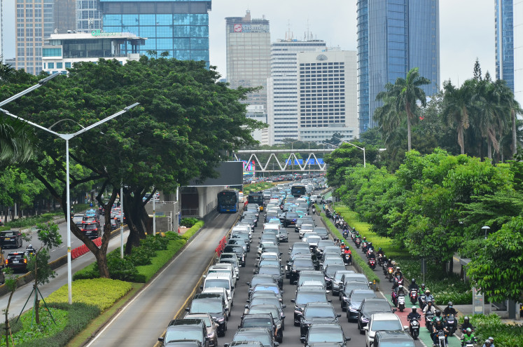 Congested traffic is seen on Wednesday, Feb. 11, 2026, during the afternoon rush on Jl. Jend. Sudirman, South Jakarta. Jakarta plans to finalize a 25-year roadmap on air quality control and protection by the end of this year.