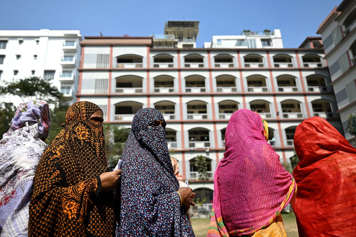 Women wait to cast their ballot at a polling station during Bangladesh's general election in Dhaka on February 12, 2026. 