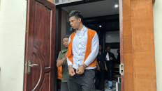 Brazilian national Yuri Bezzera da Costa leaves the Denpasar District Court in Bali on Feb. 12, 2026, after being sentenced to 18 years in prison for trafficking 3 kilograms of cocaine.