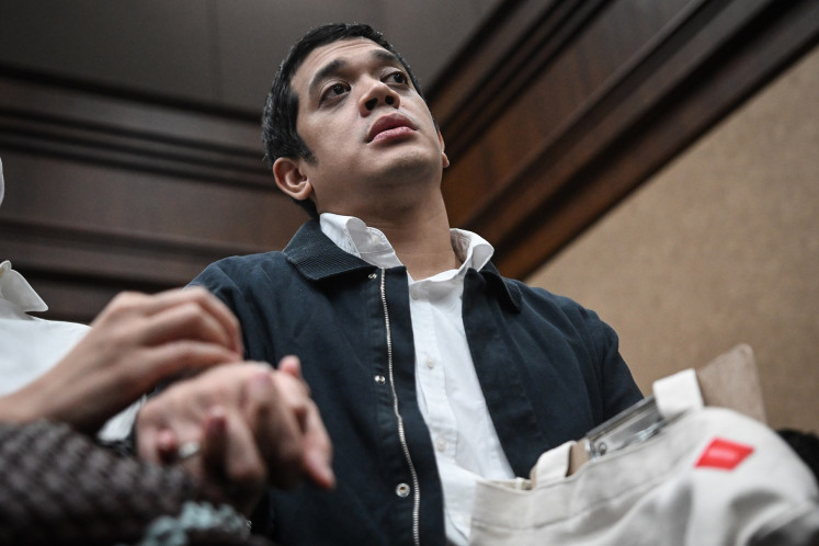 Graft defendant Muhammad Kerry Adrianto Riza, son of oil tycoon Riza Chalid and beneficial owner of fuel terminal company PT Orbit Terminal Merak, sits in the courtroom of the Jakarta Corruption Court in Jakarta on Feb. 13, 2026 ahead of his sentence demand hearing. Prosecutors demanded Kerry be sentenced to 18 years in prison for his alleged role in a corruption case pertaining to crude oil procurement at state energy company Pertamina.