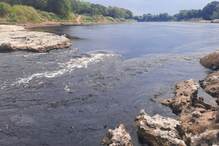 An eddy whirls amid calm waters on Sept. 11, 2021, in the Solo River of Central Java.