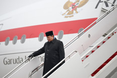 President Prabowo Subianto walks from his plane on Feb. 17 upon arriving at Joint Base Andrews in Maryland, the United States. Prabowo flew to Washington, DC, to attend the inaugural US-led Board of Peace meeting as well as a bilateral meeting with his US counterpart Donald Trump.