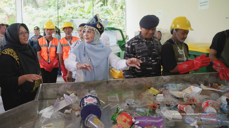 Berau Regent Sri Juniarsih Mas inspects plastic waste on Feb. 11 during the inauguration of a waste-sorting facility on Derawan Island, East Kalimantan. The popular diving and snorkeling destination is grappling with a mounting waste crisis fueled by tourism and marine debris, underscoring the growing waste management challenges faced by many small islands across Indonesia&rsquo;s vast archipelago.
