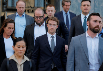 Meta Platforms CEO Mark Zuckerberg (center) departs the court on Feb. 18, 2026, in Los Angeles, United States, after taking the stand at a trial in a key test case accusing Meta and Google&rsquo;s YouTube of harming kids&rsquo; mental health through addictive platforms.