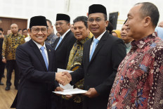Office of the Coordinating Social Empowerment Minister Muhaimin Iskandar (left) shakes hands on Feb. 20, 2026, with newly-inaugurated Health Care and Social Security Agency (BPJS Kesehatan) president director Maj. Gen. (ret) Prihati Pujowaskito during a ceremony in Jakarta. Prihati, a retired military cardiologist, will lead the healthcare agency from 2026 to 2031, replacing Ali Ghufron Mukti who held the position since 2021.