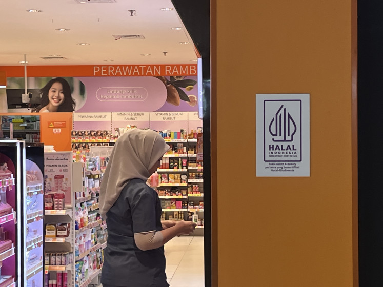 A halal certificate is displayed on Feb, 23, 2026, on the storefront of a health and beauty outlet inside the Mall@Bassura retail complex in Jatinegara, East Jakarta.