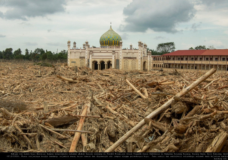 Thousands of tonnes of wood and mud cover the grounds of Pondok Pesantren Darul Mukhlisin, an integrated Islamic boarding school in Tanjung Karang, a village in Karang Baru district, Aceh Tamiang regency, Aceh, following the November 2025. disaster  in northern Sumatra. 