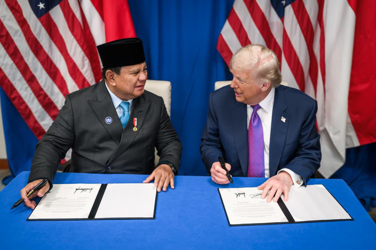 President Prabowo Subianto (left) speaks to United States President Donald Trump (right) during the signing of the US-Indonesia Agreement on Reciprocal Tariffs (ART) in Washington, DC, on Feb. 19, 2026. The trade deal locks in tariff rates and non-tariff barriers to commerce between Indonesia and the US. 