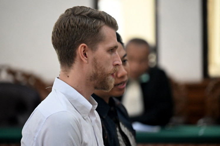 British national Kial Garth Robinson attends his trial at a court in Denpasar on the Indonesian resort island of Bali on February 26, 2026. Two British men were given lengthy jail terms on February 26 by an Indonesian court after being found guilty of smuggling cocaine into the popular holiday island of Bali.