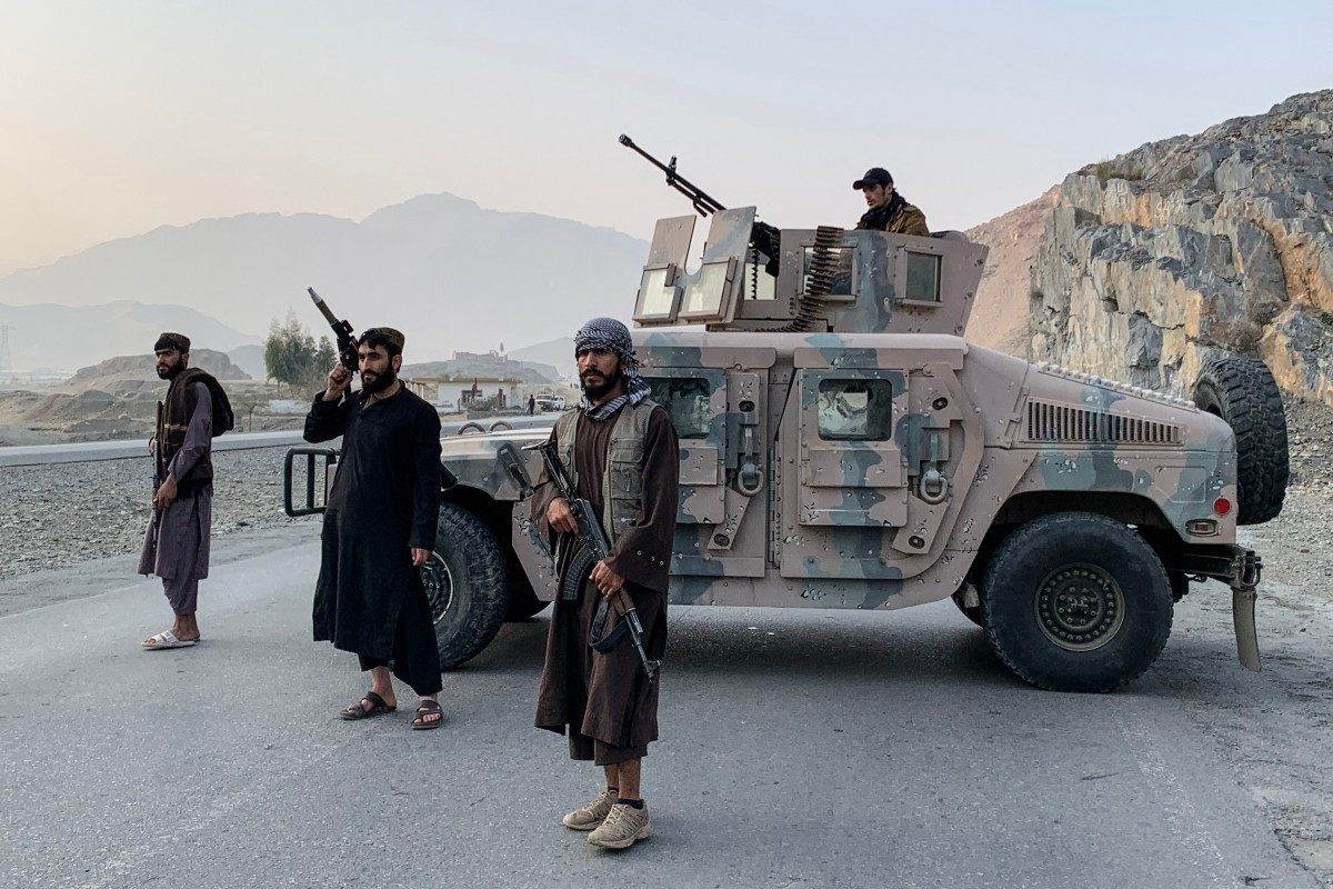 Taliban security personnel stand guard near the Torkham border crossing between Afghanistan and Pakistan in the Nangarhar province on February 27, 2026. 