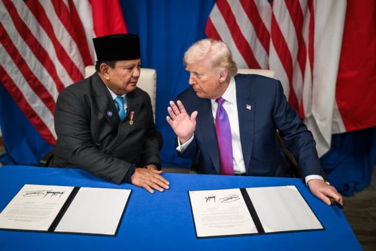 President Prabowo Subianto (left) listens to United States President Donald Trump on Feb. 19, 2026, during the signing ceremony for the US-Indonesia Agreement on Reciprocal Tariffs (ART) in Washington, D.C.