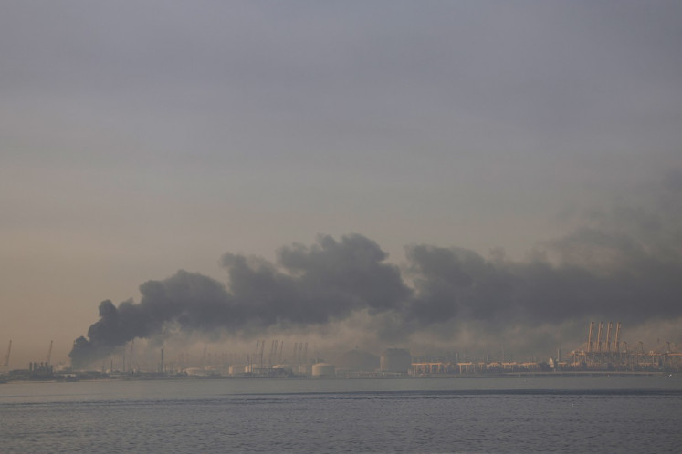 A plume of smoke rises from the port of Jebel Ali following a reported Iranian strike in Dubai on March 1, 2026. 
