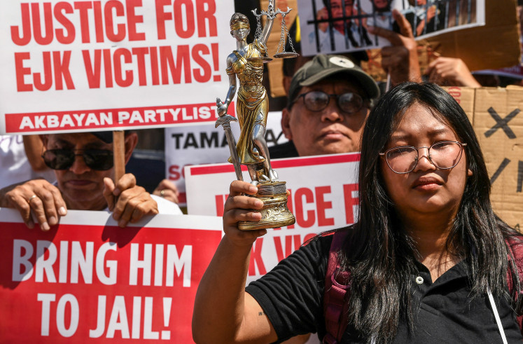 Activists and supporters take part in a protest in Manila on Feb. 23, 2026, to demand justice for the victims of extrajudicial killings during the drug war of former Philippine president Rodrigo Duterte.