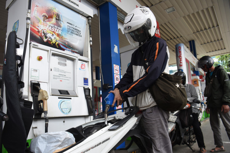 Stock up: Motorcyclists line up to refuel with non-subsidized fuel Pertamax on Sunday, March 1, 2026, at a gas station in the Kuningan area, Jakarta. State oil and gas giant PT Pertamina (Persero) adjusted the prices of non-subsidized fuel, starting effectively on March 1.