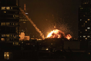 A fireball lights the sky following a missile strike on Tel Aviv on February 28, 2026. The United States and Israel launched strikes against Iran on February 28, with Israel's public broadcaster reporting that the Iranian supreme leader had been targeted, as the Islamic republic retaliated with barrages of missiles at Gulf states and Israel. 